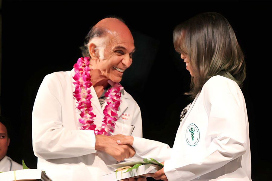 DOCTOR DON PARSA SHAKING HANDS WITH NEW MEDICAL DOCTOR