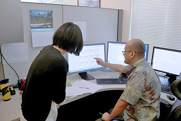 Bioinformatics Core staff analyzing data on the computer