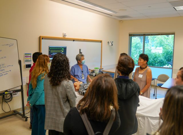 High school educators tour the JABSOM SimTiki.